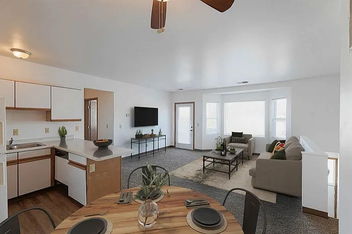 Inviting open-concept living space with a cozy living room, modern kitchen, and stylish dining area, perfect for relaxing and entertaining.