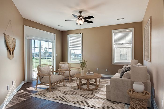 Bright and airy living room with chic decor, featuring comfortable seating, natural light, and a cozy ambiance.
