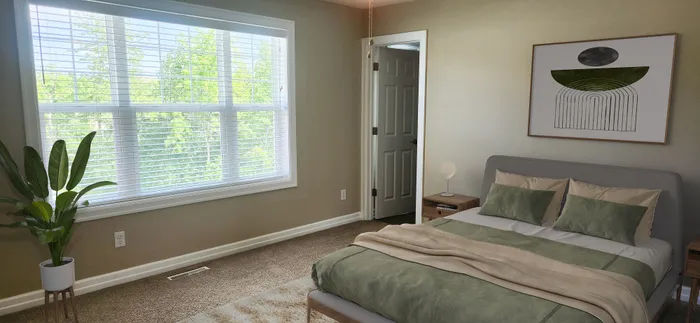Inviting bedroom with plush carpeting, a large window welcoming natural light, modern decor, and vibrant indoor plant.