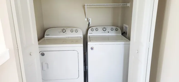 Chic laundry nook with modern washer and dryer, offering convenience and style.