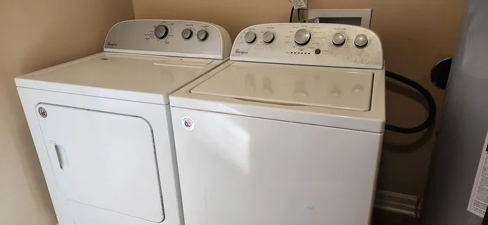 Modern laundry room featuring a sleek washer and dryer set, ideal for convenient in-home cleaning.