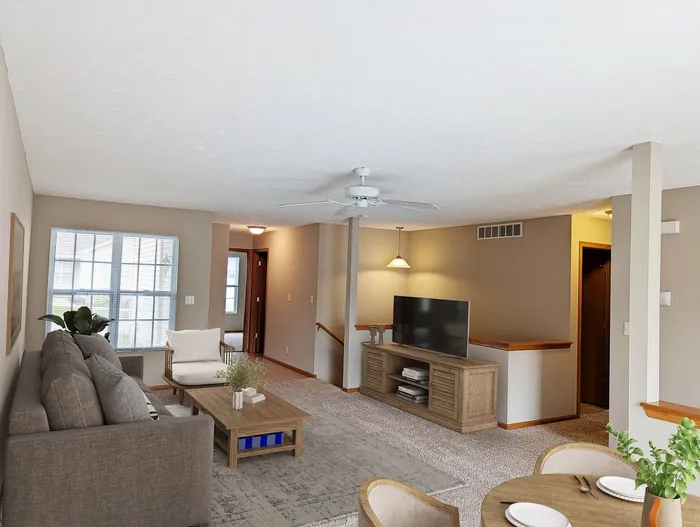 Charming living room with cozy furniture, bright windows, and modern decor, ideal for comfortable living and entertaining.