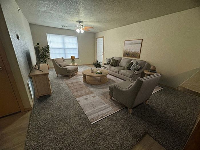 Cozy and inviting living room with plush seating, elegant decor, and soft lighting, perfect for relaxation and entertaining.