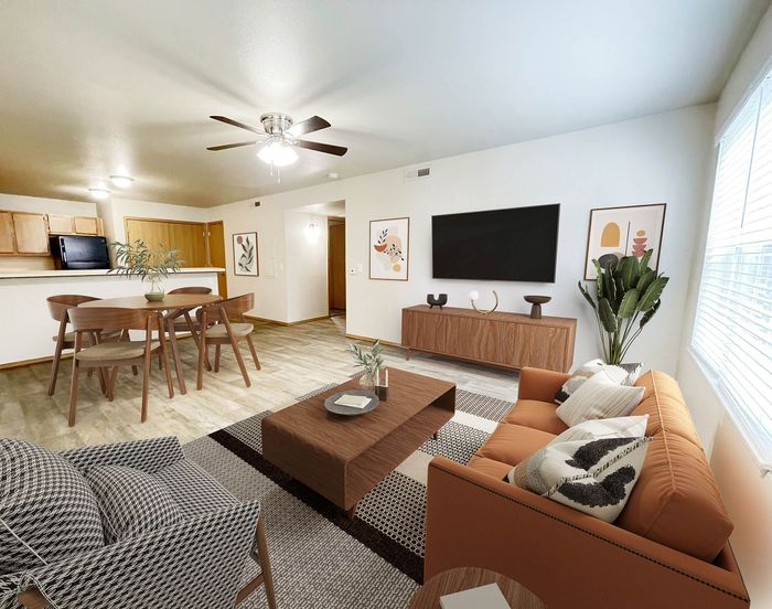 Elegant open-plan living and dining area featuring chic furniture, modern decor, and a cozy atmosphere.