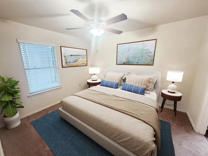 Inviting bedroom with a cozy bed, stylish wall art, and abundant natural light, perfect for relaxation.