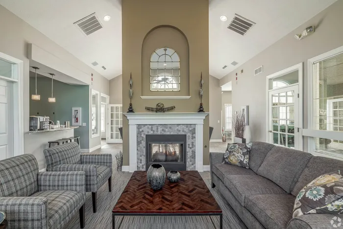 Chic living room featuring a modern fireplace, stylish seating, and an elegant coffee table, perfect for entertaining.