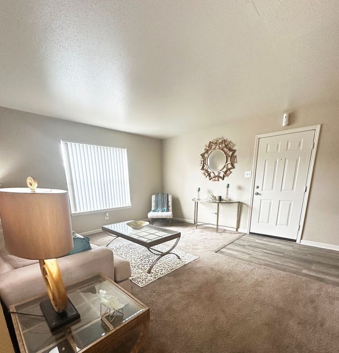 Inviting living room with chic decor, plush seating, and modern accents creating a warm and welcoming atmosphere.