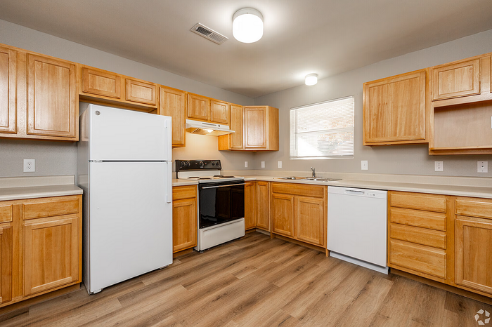 Bright and inviting kitchen with warm wooden cabinetry, modern appliances, and sleek countertops for a stylish culinary experience.