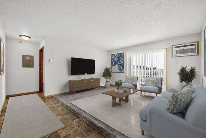 Inviting living room showcasing elegant furniture, modern decor, and abundant natural light from large windows.
