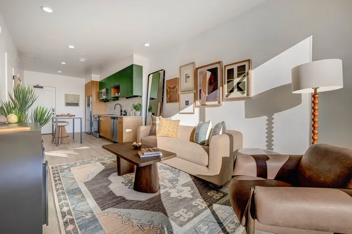 Inviting living space featuring modern furnishings and open kitchen.