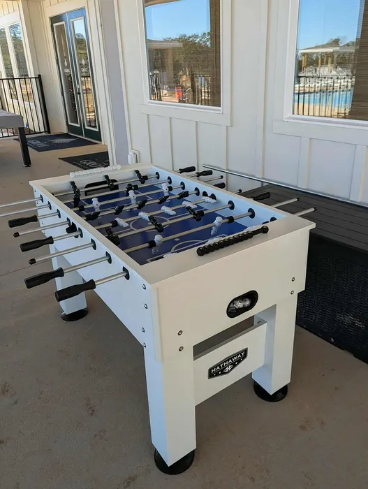 Chic recreational area with a modern foosball table, offering vibrant community amenities and leisure options.