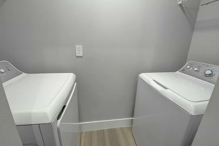 Sleek and modern laundry room with energy-efficient washer and dryer, perfect for convenient living.