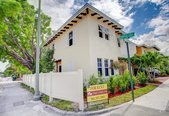 Charming corner townhouse for rent with 3 bedrooms, 2 and a half baths, lush landscaping, and bright exterior. Perfectly located along Federal Hwy, offering spacious living in a serene neighborhood.