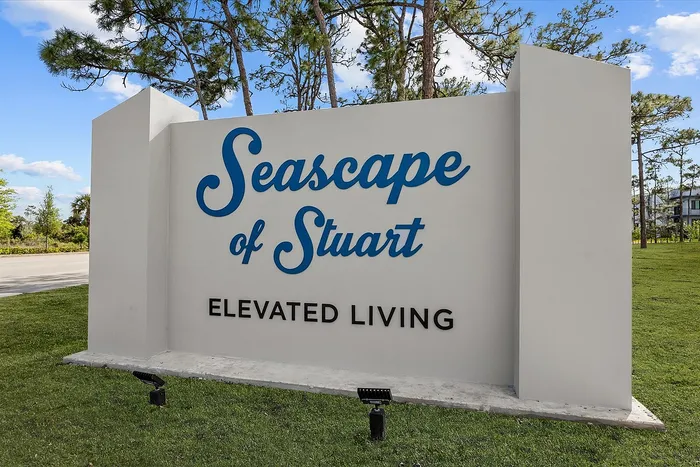 Inviting entrance sign for Seascape of Stuart, highlighting a promise of elevated living amidst lush greenery and serene surroundings.