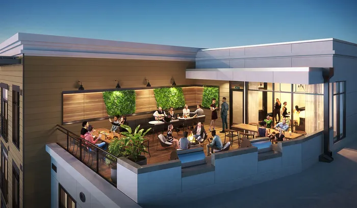 Chic rooftop terrace featuring lush green walls and stylish seating area for social gatherings.