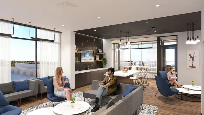 Elegant lounge area with modern furnishings, featuring spacious seating and natural light from large windows, creating a warm and inviting atmosphere.