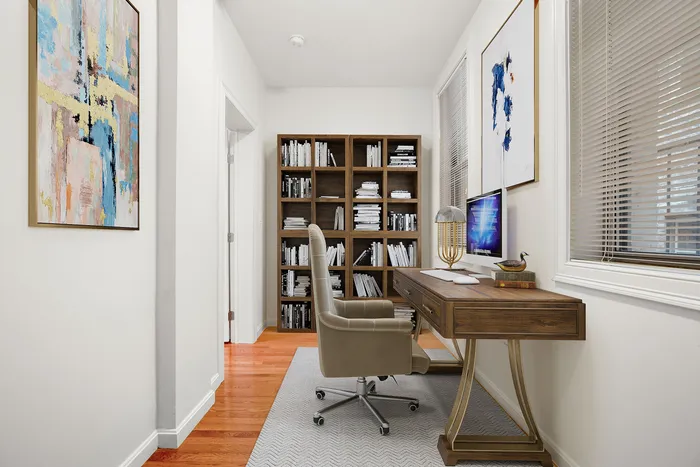 Chic home office with elegant wooden desk, cozy ergonomic chair, and art-filled walls, perfect for productivity.
