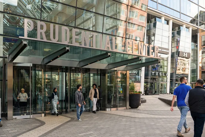 Vibrant entrance of Prudential Center featuring sleek modern architecture and bustling pedestrian activity.