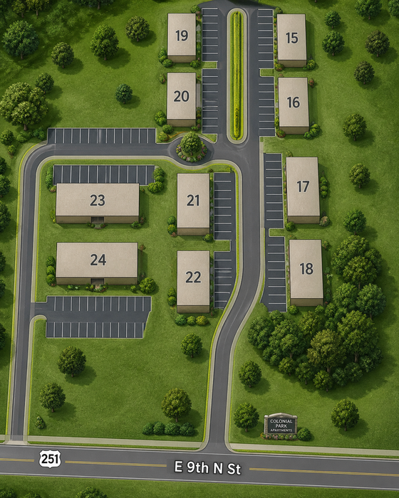 Aerial view of Colonial Park Apartments layout, featuring buildings numbered 15 to 24, set amidst lush greenery and ample parking areas on E 9th N St.