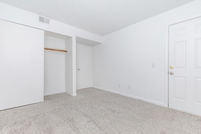 Bright and inviting room with plush carpet and ample closet space, perfect for creating your ideal living area.