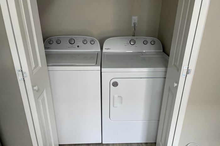 Convenient in-unit laundry with modern washer and dryer set in a compact, accessible space.