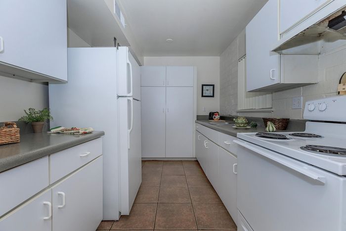 Contemporary kitchen with sleek cabinetry, spacious countertops, and modern appliances, creating an inviting culinary space.