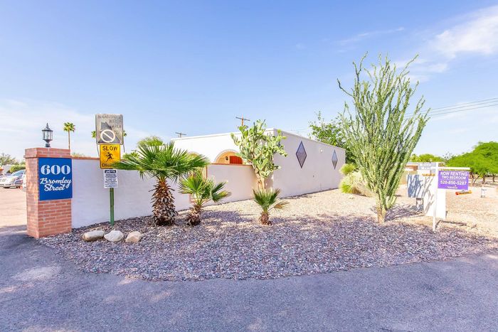 Charming desert property with unique architecture, vibrant landscaping, and two-bedroom rentals available.