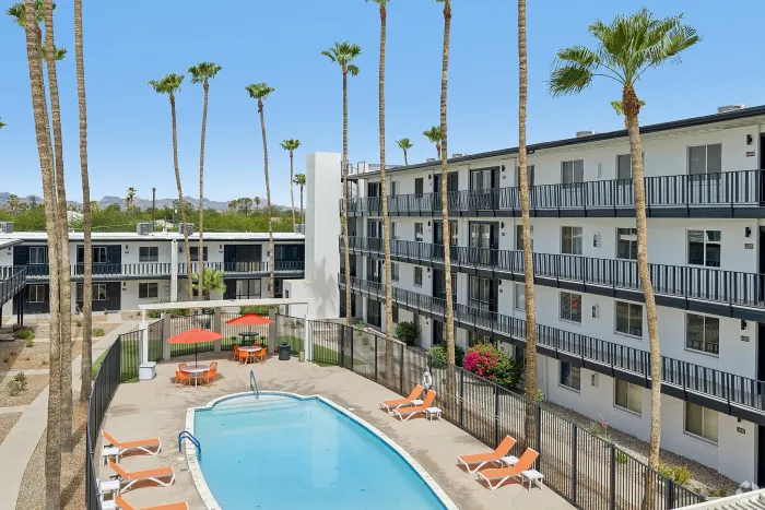 Resort-style swimming pool and lounge area at Miramonte on 3rd apartments in Tucson, AZ