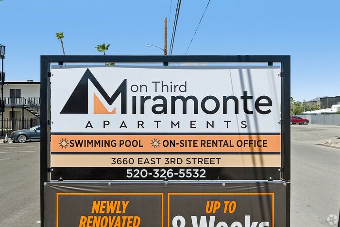 Contemporary sign for On Third Miramonte Apartments, showcasing modern living amenities including a swimming pool and on-site rental office.