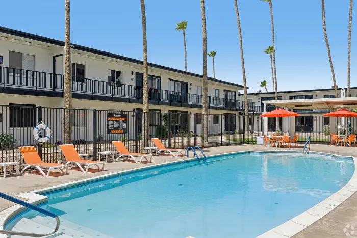 Resort-style swimming pool and lounge area at Miramonte on 3rd apartments in Tucson, AZ