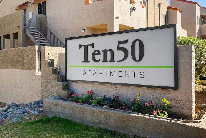 Inviting exterior of Ten50 Apartments with charming landscaping and modern architecture.