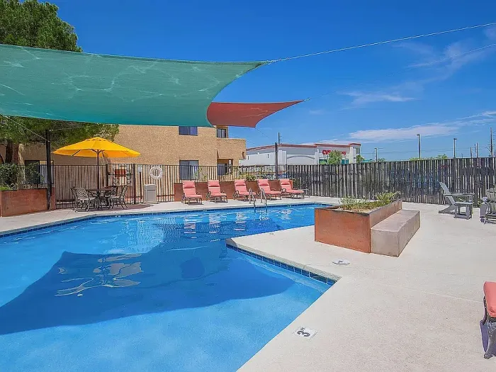 Outdoor swimming pool at Puesta del Sol in Tucson, AZ, offering a relaxing space under the Arizona sun.