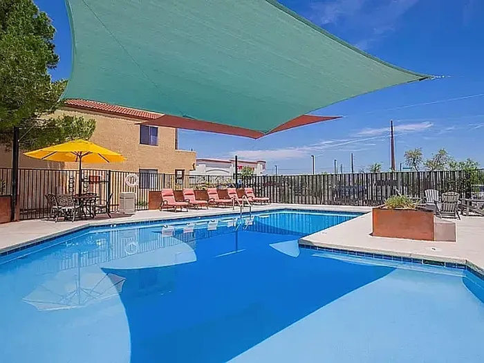 Sparkling outdoor pool at the Puesta del Sol property in Tucson, AZ, with a sunny desert setting.