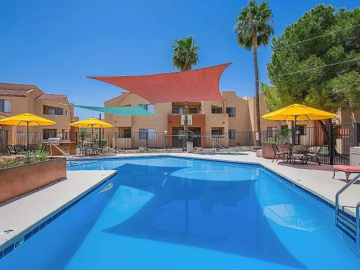Inviting swimming pool at Puesta del Sol property in Tucson, AZ, featuring a peaceful outdoor setting.