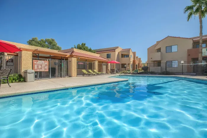 Inviting swimming pool at Puesta del Sol property in Tucson, AZ, featuring a peaceful outdoor setting.