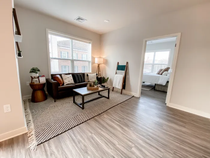 Living Area in with Open Bedroom Door at Incite at Troy | Apartments in Troy, New York