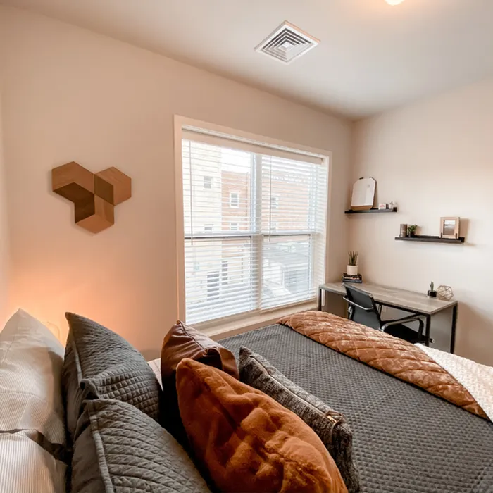 Decorated bedroom with desk at Incite at Troy | Student Apartments in Troy, NY
