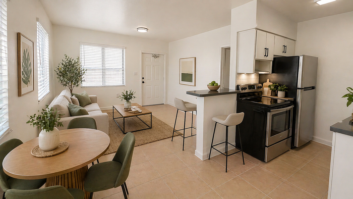 Bright and modern open-concept living space with cozy seating, a stylish kitchen, and elegant dining area.