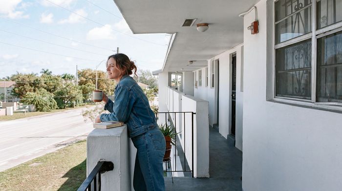 Bright balcony view offering a relaxing outdoor space, perfect for enjoying a peaceful moment with a coffee and scenic outlook.