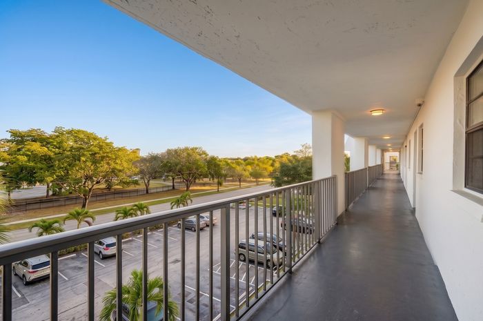 Inviting apartment balcony with scenic views of lush greenery and a serene ambiance, perfect for relaxation.