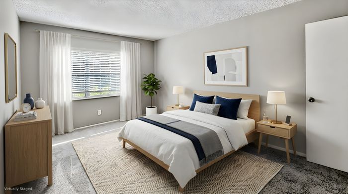 Bright and modern bedroom with minimalist decor, featuring a cozy bed, stylish nightstands, and a lush potted plant by the window.