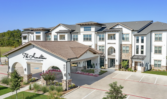 Charming modern apartment complex featuring elegant architecture, spacious balconies, and lush landscaping at The Hamilton.