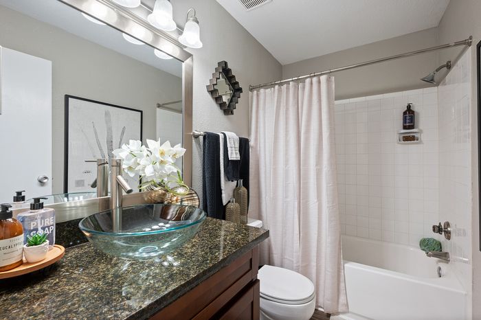 Lakeside at Campeche 2 bed 2 bath view of guest bathroom with garden tub and shower combo