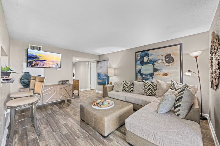 Lakeside at Campeche 2 bed 2 bath model front entrance looking into living room from dining room