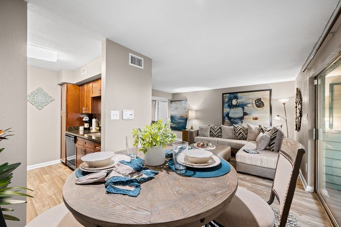 Lakeside at Campeche 2 bed 2 bath model front entrance looking into living room dinigroom and guest bathroom