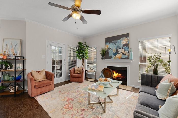 Charming living room with cozy fireplace, elegant decor, and inviting natural light, perfect for relaxation.