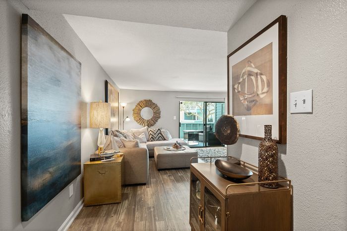 Lakeside at Campeche 2 bed 2 bath model front entrance looking into living room dinigroom and guest bathroom