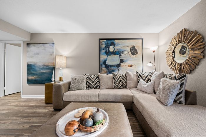Lakeside at Campeche 2 bed 2 bath model front entrance looking into living room dinigroom and guest bathroom