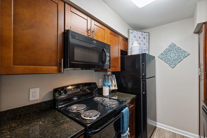 Lakeside at Campeche 2 bed 2 bath model front entrance looking into living room dinigroom and guest bathroom