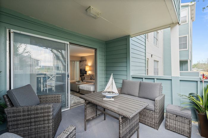 Lakeside at Campeche 2 bed 2 bath model front entrance looking into living room dinigroom and guest bathroom